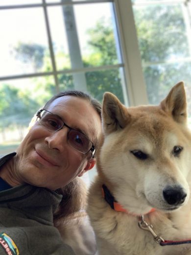 Portrait of smiling man with glasses with his face next to handsome Shiba Inu Sephy. They are buddies forever. We miss you wonderful boy.